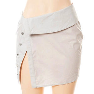 Detail of high waist grey skirt with asymmetric folded waistline and metal buttons
