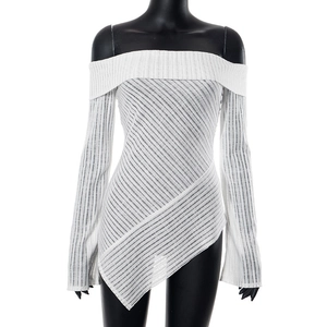 Detail of white off-shoulder top showing ribbed texture and irregular asymmetric hemline
