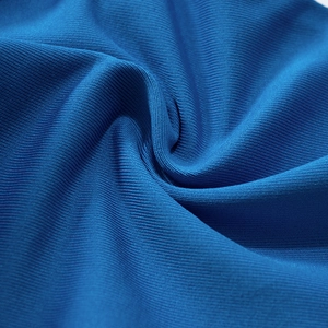 Detailed macro shot of royal blue knit fabric with dense horizontal ribbing texture