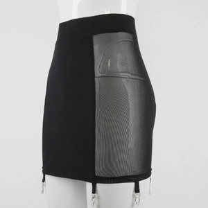 Detail of black mini skirt featuring mesh patchwork and functional metal garter clips