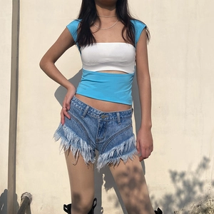 Slim fit two-tone backless top paired with vintage fringe denim shorts for women