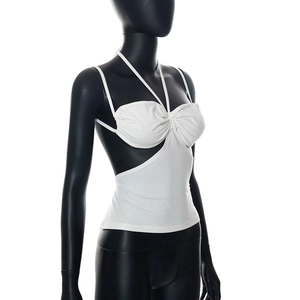 Close-up of white halter neck crop top with side cut-outs and ruched chest detail
