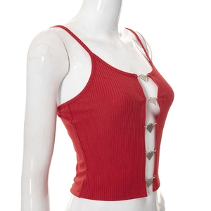 Detail of red ribbed crop top featuring decorative silver heart-shaped metal buckles
