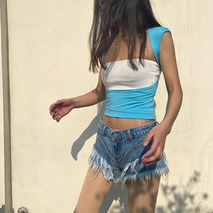Women's slim fit blue and white patchwork open back top with fringed denim shorts set