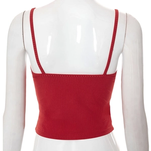 Detail view of red knitted crop tank top showing vertical ribbed texture and thin straps