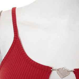 Detail of red ribbed knit crop top featuring a silver heart-shaped metal buckle detail