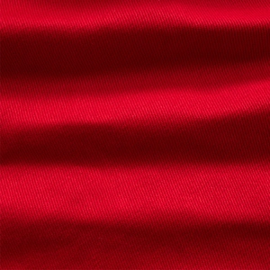 Détail macro du tissu sergé rouge montrant une texture durable et une couleur vive