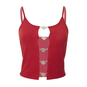 Close-up of red ribbed crop top featuring heart-shaped metal buckles and cutout detail