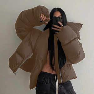 Detailed view of coffee brown quilted puffer jacket with zipper and hooded design