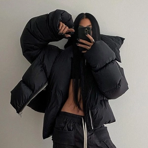 Oversized black puffer jacket with high collar and glossy finish for women's street style