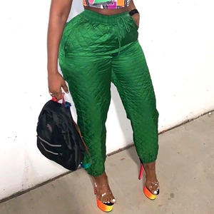 Women's bright green quilted joggers with elastic high waist and drawstring design
