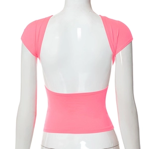 Rear view of neon pink backless crop top with cap sleeves and high-stretch knit fabric
