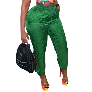 Women's green quilted padded jogger pants with drawstring waist and diamond pattern