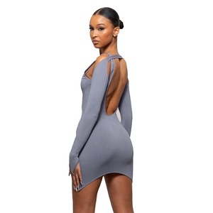 Detail of gray long sleeve mini dress featuring open back and asymmetric irregular hemline