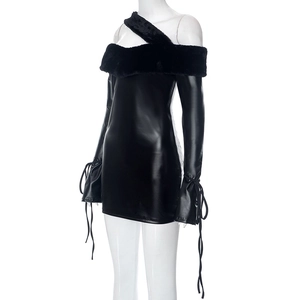 Detail of black strapless mini dress featuring faux fur neckline and glossy leather texture