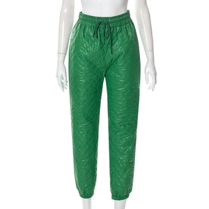 Detail of green diamond quilted joggers with drawstring waist and elastic cuffs