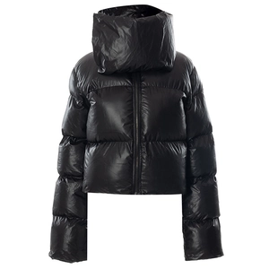 Detail view of shiny black padded puffer jacket with high funnel neck and quilted texture