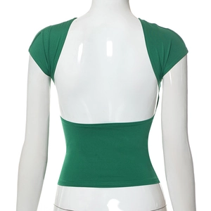 Detail of green backless crop top featuring a slim fit and minimalist hollow-out design