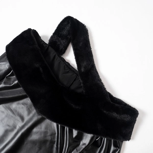 Detail of black faux fur collar and premium leather texture on a strapless dress