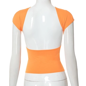 Detailed back view of orange slim-fit top with a deep open back and high elasticity