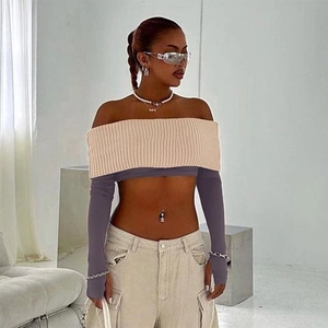 Detail of off-shoulder cropped top with beige ribbed trim and contrast purple knit fabric