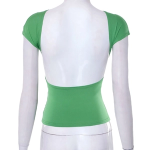 Detail of slim fit green backless top showing cutout design on mannequin with white background