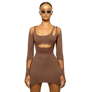 Close-up of brown long sleeve dress with cutout details and slim fit knit fabric