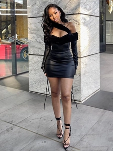 Chic black mini dress with asymmetric fur trim and long sleeves for street style fashion