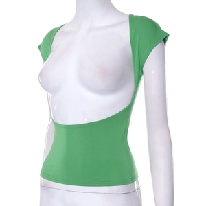 Detailed back view of green backless knit crop top showing seamless stitching and fit
