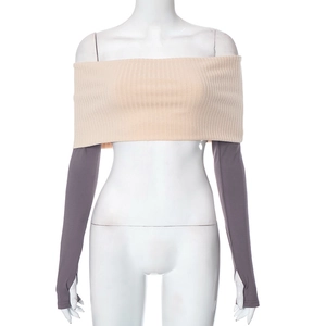 Detailed close-up of ribbed tube top and grey sleeves with thumbhole design features