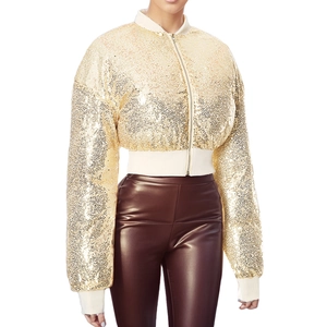 Detail of gold sequin bomber jacket with ribbed cuffs and metallic zipper closure