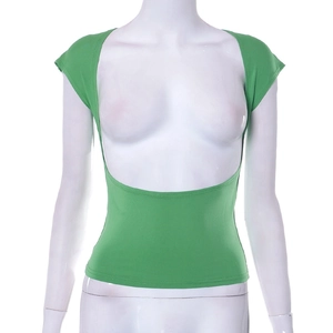 Detail of green knit crop top showing vibrant fabric texture and low-cut backless design