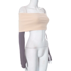 Detail of knit crop top with purple thumb-hole sleeves and ribbed texture