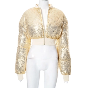 Detailed close-up of golden sequins on a short bomber jacket with ribbed cuffs