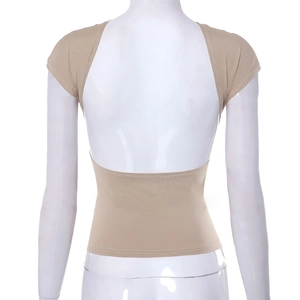 Detailed view of backless beige slim top with minimalist cut-out and elastic fabric