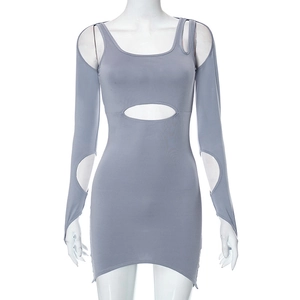 Detail view of grey long sleeve mini dress featuring waist cutout and ribbed knit fabric