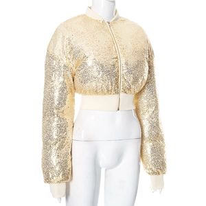 Close-up of champagne gold sequin jacket featuring metallic zipper and ribbed knit edges
