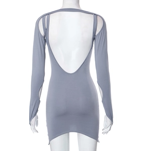 Macro shot of backless design and cutout long sleeves on slim fit knit dress