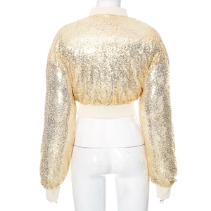 Detail of gold sequin crop jacket featuring white ribbed knit cuffs and hem on the back
