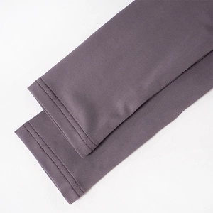 Detailed close-up showing the smooth stitching and purple elastic fabric of the sleeve cuff