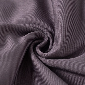 Close-up of deep purple ribbed knit fabric texture with elastic vertical patterns