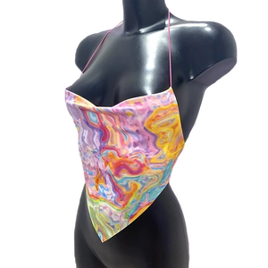 Detailed macro view of the silky tie-dye bandana top with vibrant marble patterns