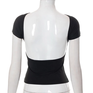 Detail view of women's black slim fit top showing deep U-shaped backless design on mannequin