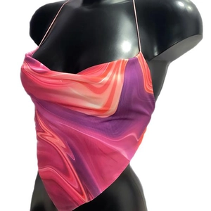 Detail of backless halter top featuring purple marble print and handkerchief hemline