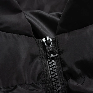 Detailed close-up of a high-quality black resin zipper on a winter padded jacket