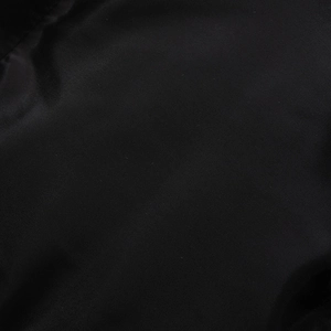 Macro detail of high-quality black twill synthetic fiber fabric used for slim fit jackets