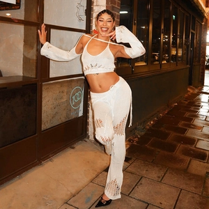 White crochet knit three-piece set with halter top, wide-leg pants and arm sleeves
