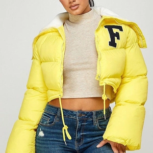 Detailed view of yellow cropped puffer jacket with white shearling collar and F patch