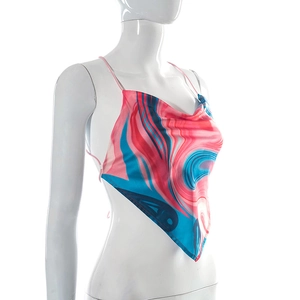 Detail of satin backless crop top featuring pink and blue marble fluid pattern and cowl neck