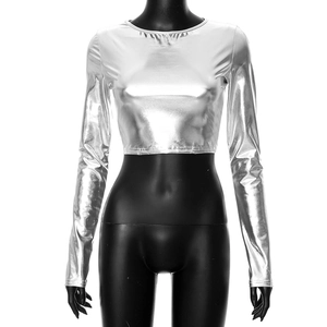 Detail of silver metallic long sleeve crop top with shiny reflective texture and crew neck